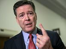 James Comey surrenders to police after being accused of chilling 'threat' on Trump's life as he declares: 'I'm innocent'