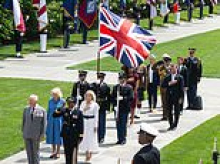 Diplomatic gaffe threatens red (white and blue) faces all round during King and Queen's visit to Virginia's Arlington National Cemetery... but can you spot what's wrong?