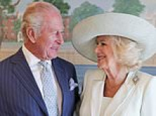 Charles and Camilla say 'God Bless America' in heartfelt leaving message after triumphant US trip as Donald Trump hails 'the greatest king'