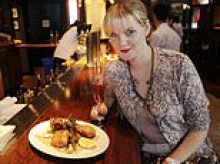 Glamorous owner of legendary restaurant ordered to pay $1million after feud with ex-partner as eatery faces closing for good