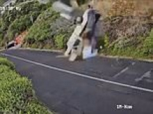 Incredible moment driver goes off a cliff when his brakes fail... only to emerge from wrecked vehicle without a scratch!