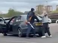 Shocking moment thug attacks pensioner, 77, with a MACHETE after he is stabbed in car