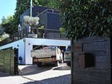 Celebrity chef Tom Kerridge is ordered to tear down 'intrusive' gates at his £3million riverside mansion