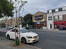 Man fighting for life after being found stabbed 700 metres from Brixton 'barbecue party' where four people were shot just one hour earlier