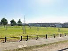 Hunt for two men in dark clothing after a woman is stabbed in park in broad daylight attack