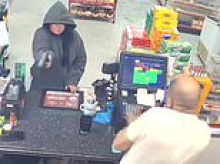 Gas station clerk narrowly avoids fatal shooting as crazed woman attempts to rob store at gunpoint