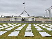Why dozens of body bags have been placed on the lawn of Australia's parliament