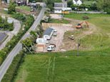 The traveller Bank Holiday land grabs: Army of workers using diggers and lorries drag caravans into villages across Kent and Essex - as councils close for long weekend