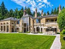 Telecom mogul's enormous waterfront mansion in crime-ridden Seattle sells for GIGANTIC discount on its original $85m listing price