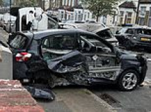 Moment police chase ends in carnage as driver smashes into parked cars on quiet residential road