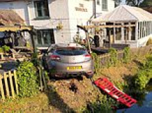 Pub landlady calls for warning signs to be installed at dangerous T-junction after NINE vehicles plunge into river or fly through her beer garden fence