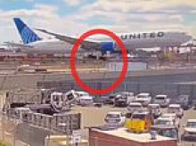 Harrowing moment United flight hits light pole and truck while landing at Newark Airport