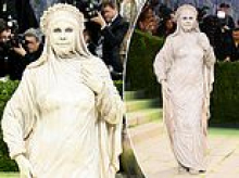 A-list star baffles Met Gala fans in bizarre living statue outfit... but can you guess who?