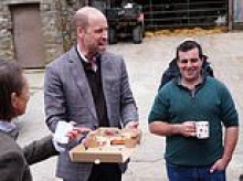 Prince of cakes! William hands out sweet treats to farmers during North Yorkshire outing...as he reveals the one dessert he can't resist