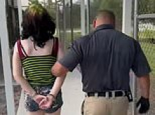 Shocking moment green-haired Florida girl aged TWELVE is perp-walked over claims she threatened to shoot up a school