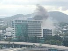 Huge fire breaks out in office building in Brisbane: Person trapped on the roof