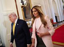 Donald Trump woos military mothers with shiny grin next to 'incredible mom' Melania during Mother's Day tribute