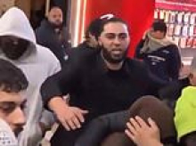 Member of ISIS bride Zahra Ahmad's entourage calls female reporter a 's***' during wild scenes at Melbourne Airport
