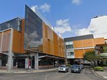 Teenager attacks three people with a KNIFE inside a Woolworths at busy shopping centre - as police swarm the scene