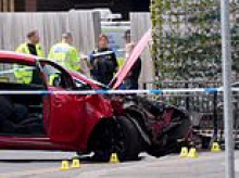 Man, 40, is arrested on suspicion of attempted murder after 'car ploughed into pedestrians' - leaving several people in hospital