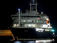 Hantavirus-stricken cruise ship arrives in Tenerife despite protests - as officials prepare to evacuate passengers and fly them home to quarantine