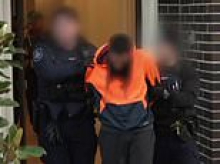 Four arrested as authorities swoop on group in Melbourne accused of sharing violent ISIS material