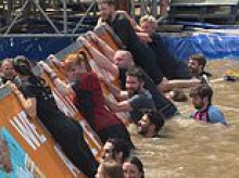 It's all going swimmingly! Angela Rayner gets muddy at charity event - but stays silent on Starmer amid criticism she campaigned in London while losing own local council
