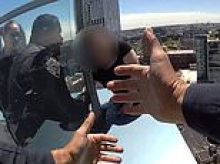 Brave cops rescue woman from cusp of death as she dangles from edge of New York City skyscraper