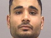 Afghan migrant, 20, in prison for attacking family-of-five is handed more jail time for assaulting prison guard 'like a man possessed'