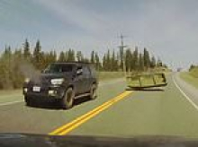 Family lucky to be alive after runaway boat flips off truck and smashes into their car in 'near-death' highway smash