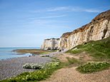 UK beach closed to the public for 20 years could soon reopen following hundreds storming the fences for 'protest picnics'