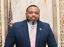 Governor's aide who faces drug trafficking charges said he should be allowed to keep $31k payout in the interests of DEI