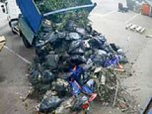 Moment shameless criminals dump mountain of waste outside business in England's fly-tipping capital