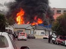 Huge inferno in NSW is battled by more than 60 firefighters as nearby homes are threatened