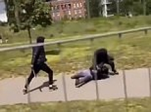 A brutal machete duel at Sunday lunchtime, another scene from Khan's 'safe' London: Video captures  masked teens attacking each other with machetes in broad daylight in family park
