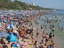 Feeling hot, hot, hot... Britain faces first ever May 'tropical night' as more heat records could be broken