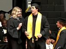 Brother of Texas teen gets standing ovation as he accepts posthumous diploma at graduation a year after his twin died while saving him at deadly track meet