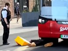 Moment 'shoplifter' steals cheese from Co-op before bizarrely rolling under bus and 'attacking' police