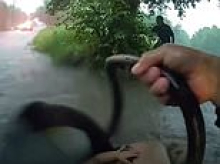 Heroic moment baby is rescued from car trapped in waist-high flood water during torrential Texas storm