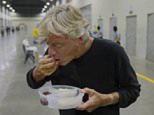 The prison meals for the 'living dead': Moment Richard Madeley joins shaven-headed inmates as they eat their dinner of rice and beans at El Salvador's mega jail
