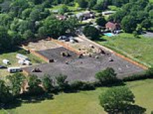 Travellers wage Bank Holiday land grabs: Diggers and bulldozers spend weekend tearing up West Sussex field while trees are cut down to make way for caravans in Kent and Lincolnshire