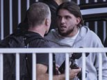 Latest group of ISIS brides and their children return to Australia as the women walk freely out of airports and photographer reveals chaotic confrontation with one of their escorts