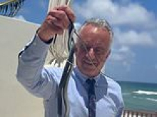 RFK Jr catches two SNAKES with his bare hands while his wife Cheryl squeals after spotting them on Dr Oz's patio