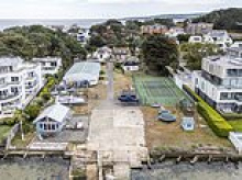 The 'most desirable' £20m Sandbanks plot that nobody can buy: Land that's home to a boat shed, cottage and tennis court is unsellable because of 100-year-old covenant