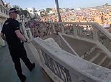 Moment police rush onto packed beach to arrest 'drunk' youngsters and pour out booze during bank holiday heatwave madness