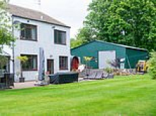 Family who built huge 'flood survival shed' after being swamped so many times they couldn't get insurance are ordered to tear it down