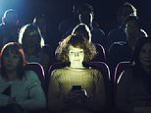 Moviegoers revolt after theater's new snack policy forces patrons to use their PHONES during films