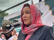 AOC dons hijab for Eid as NYC's socialist mayor stands awkwardly behind her at Muslim event