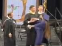 High school graduation thrown into chaos as teacher grapples with celebrating students and forces them into awkward handshakes