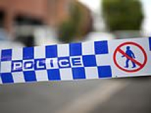 Woman charged with possessing child abuse material after an incident at a printing business